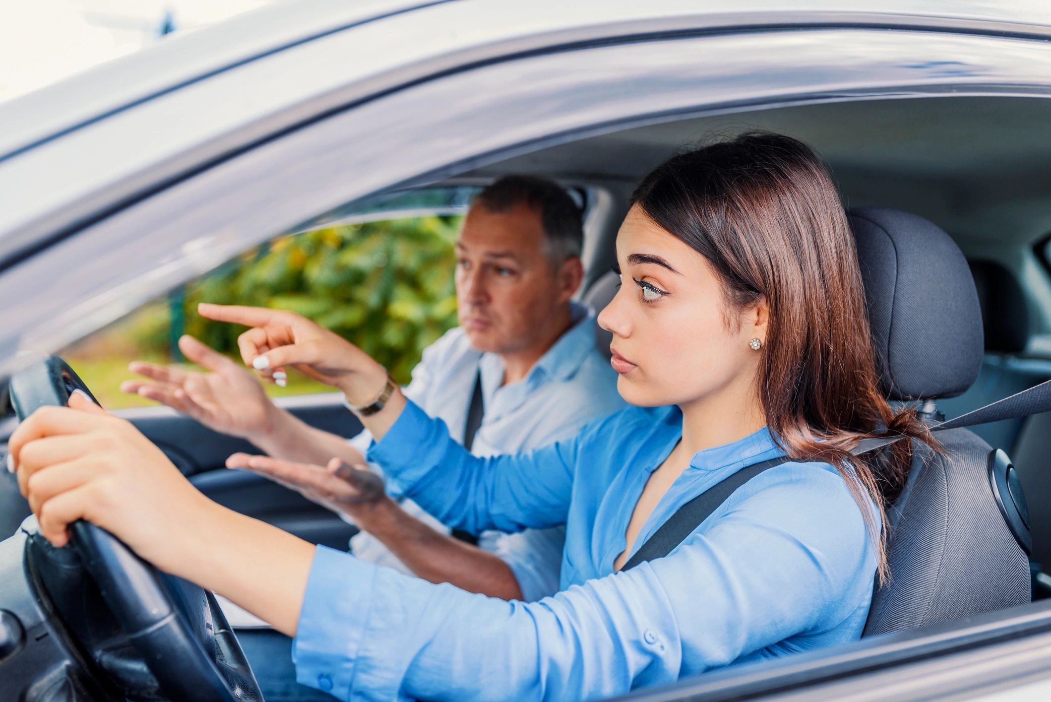 Woman taking driving lesson