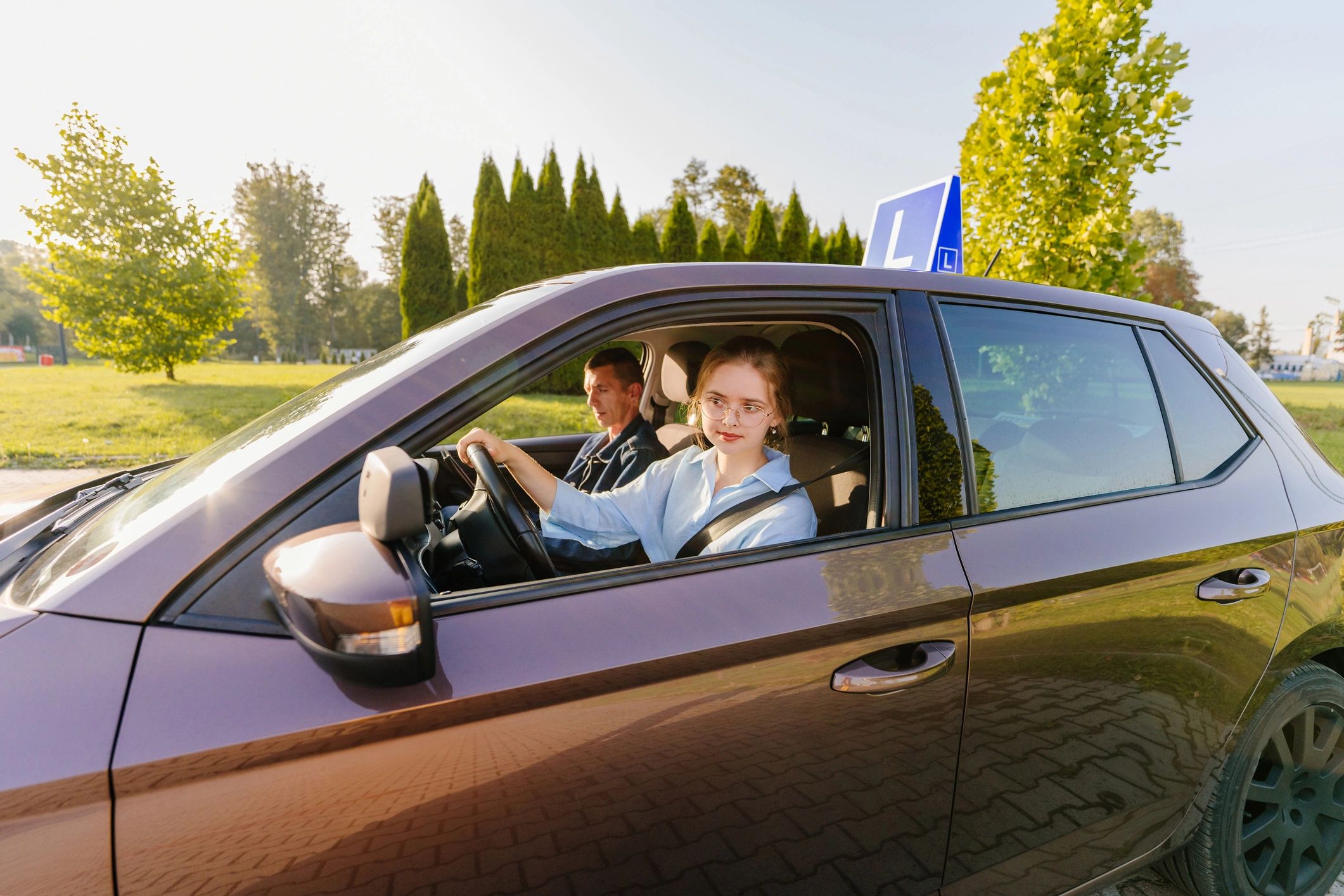 Instructor and student celebrating driving success